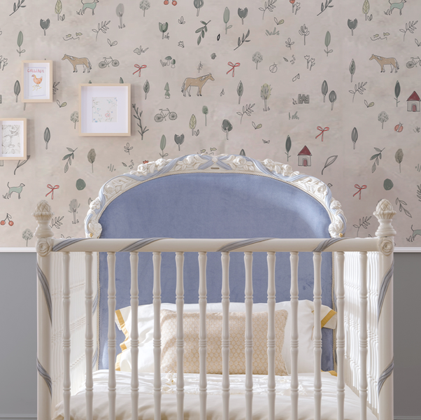 stylish white baby cot with headboard detailing