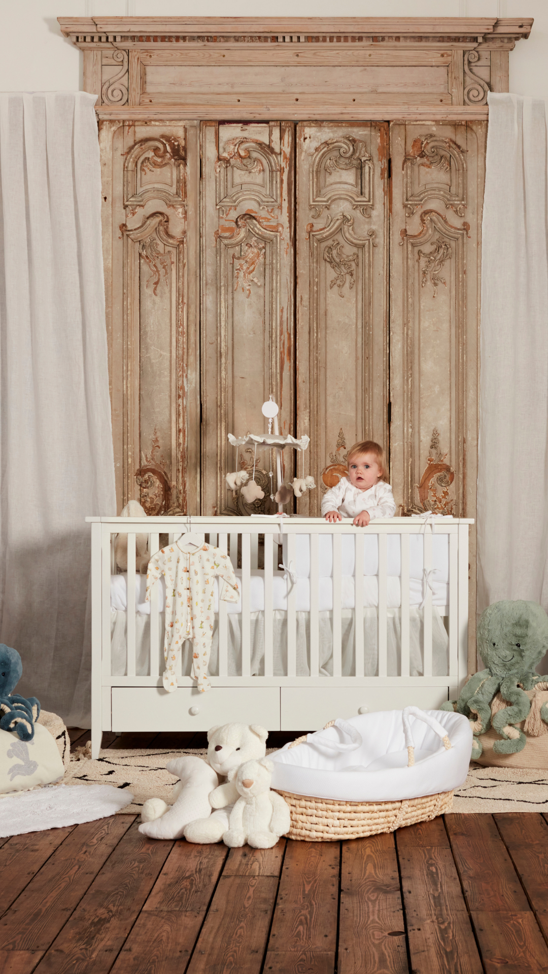 elegant moses basket in classic nursery room