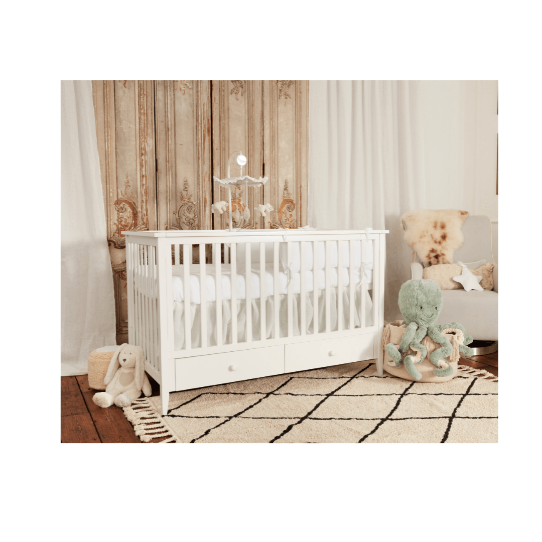 white luxury cot bed in baby nursery